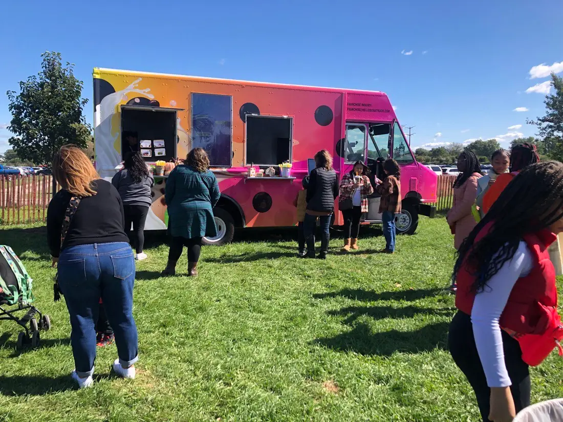 Customers lined up at a boba food truck